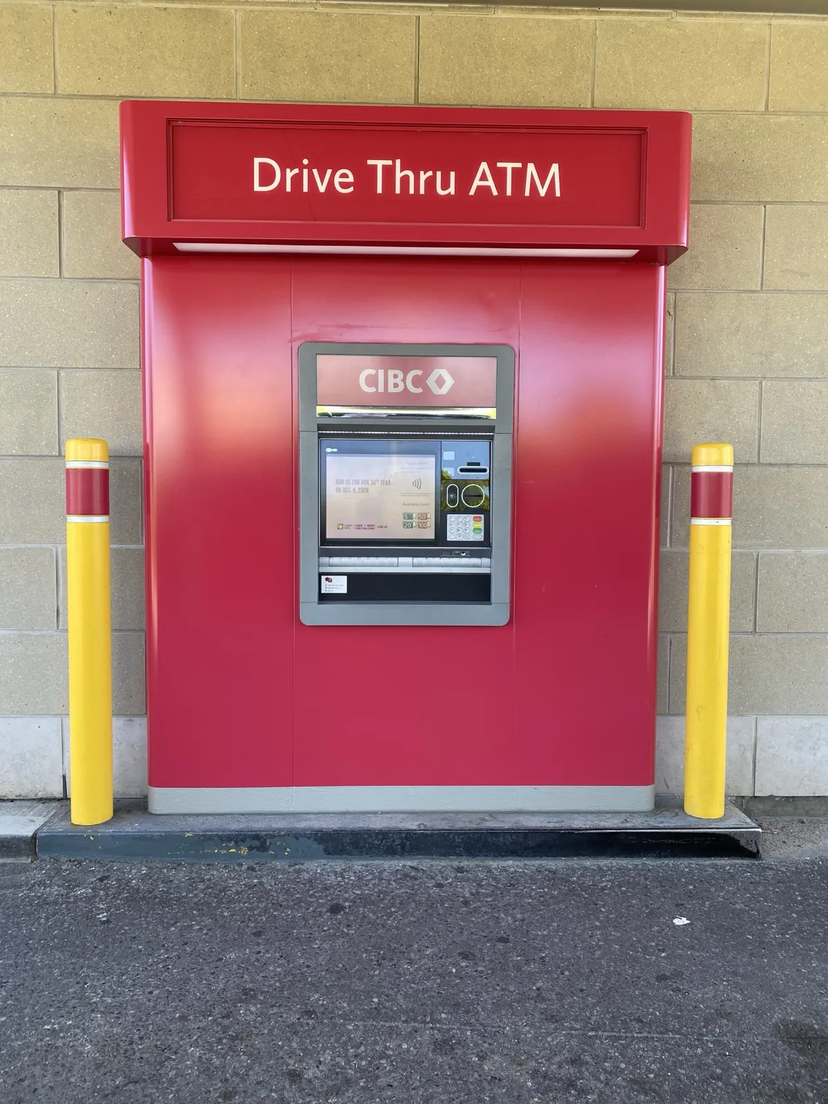 CIBC drive-thru ATM with branded red surround and illuminated Drive Thru ATM topper